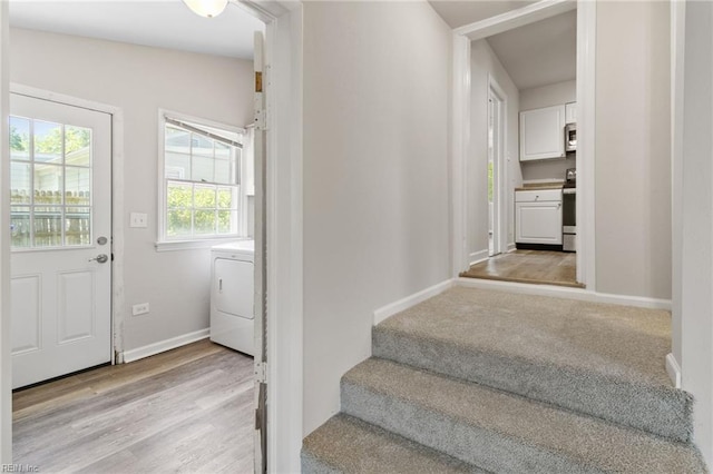 7716 Newport Ave, Norfolk, VA 23505 - stairway featuring washer / clothes dryer, baseboards, and wood finished floors