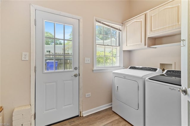 7716 Newport Ave, Norfolk, VA 23505 - laundry area with cabinet space, washing machine and clothes dryer, light wood finished floors, and baseboards