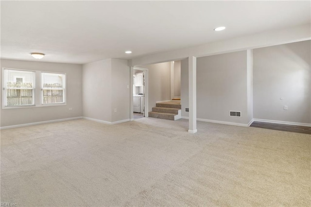 7716 Newport Ave, Norfolk, VA 23505 - spare room featuring stairway, carpet, recessed lighting, baseboards, and washer / dryer