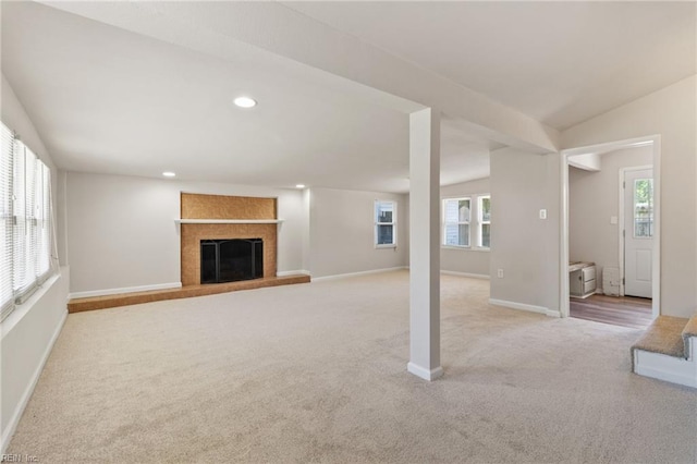 7716 Newport Ave, Norfolk, VA 23505 - unfurnished living room with carpet flooring, baseboards, a fireplace, recessed lighting, and vaulted ceiling