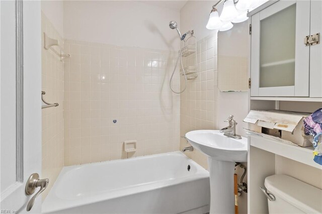 7716 Newport Ave, Norfolk, VA 23505 - bathroom featuring toilet and washtub / shower combination
