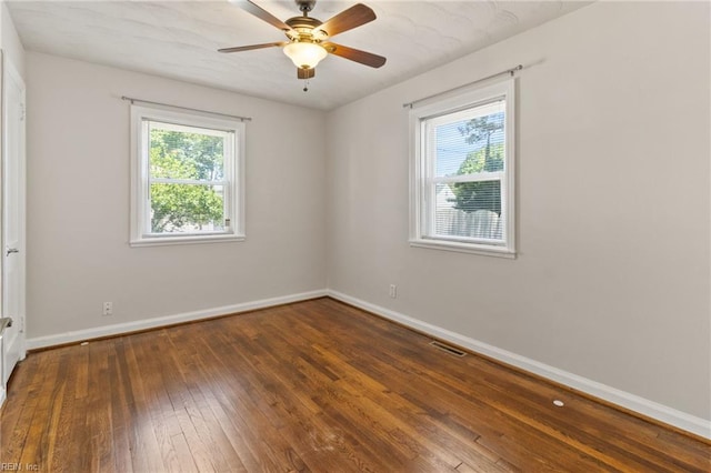 7716 Newport Ave, Norfolk, VA 23505 - empty room with plenty of natural light, baseboards, and hardwood / wood-style flooring