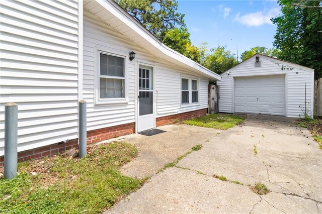 7716 Newport Ave, Norfolk, VA 23505 - doorway to property featuring a garage and concrete driveway