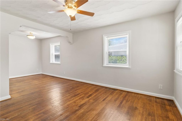 7716 Newport Ave, Norfolk, VA 23505 - empty room featuring baseboards, hardwood / wood-style flooring, and a ceiling fan