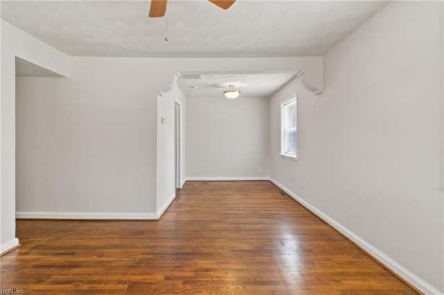 7716 Newport Ave, Norfolk, VA 23505 - unfurnished room with wood finished floors, ceiling fan, and baseboards