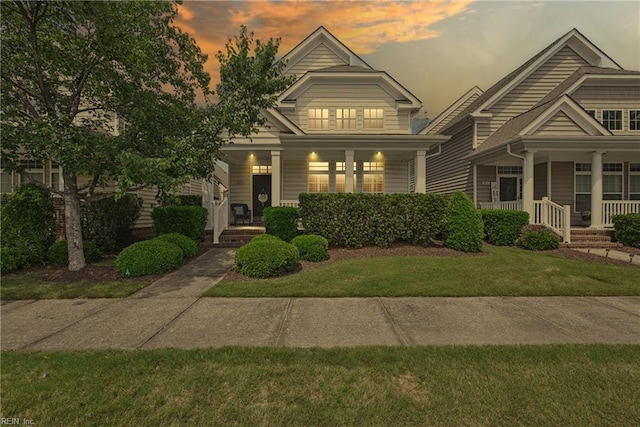 2043 Queens Point Dr, Suffolk, VA 23434 - view of front facade with a porch and a front yard