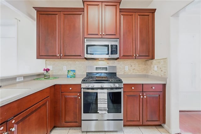 2043 Queens Point Dr, Suffolk, VA 23434 - kitchen with appliances with stainless steel finishes, light countertops, tasteful backsplash, and a sink