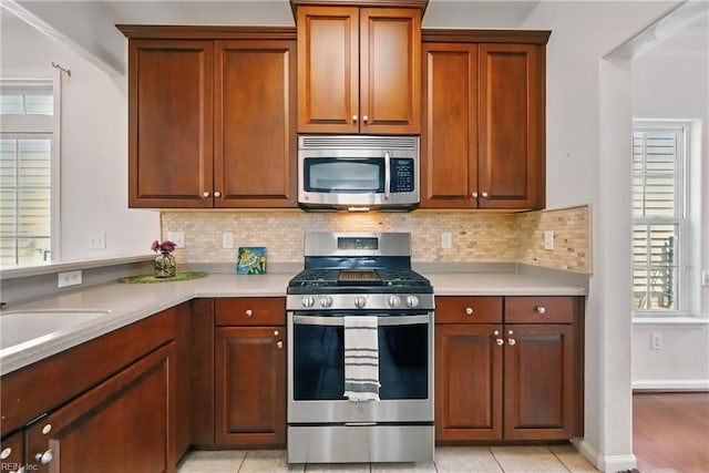 2043 Queens Point Dr, Suffolk, VA 23434 - kitchen with appliances with stainless steel finishes, light countertops, and backsplash