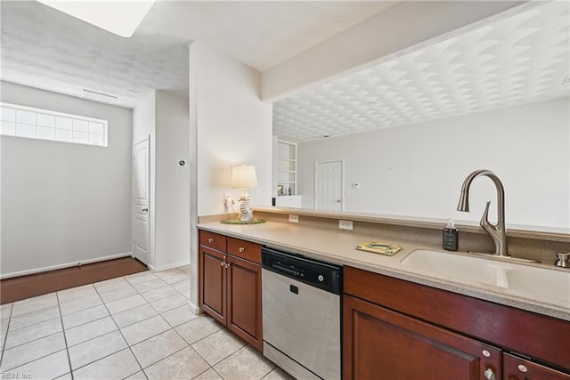 2043 Queens Point Dr, Suffolk, VA 23434 - kitchen with stainless steel dishwasher, light countertops, light tile patterned floors, and a sink