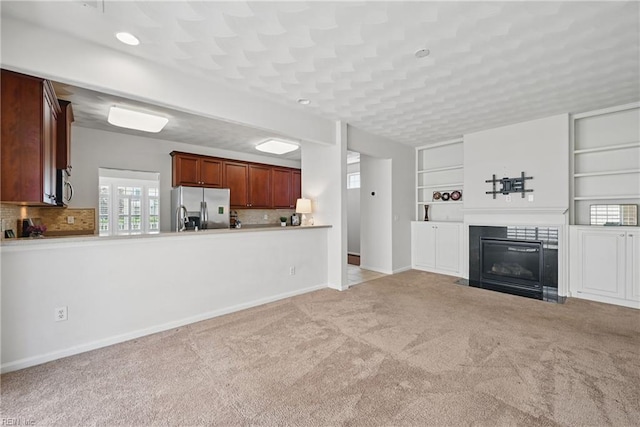 2043 Queens Point Dr, Suffolk, VA 23434 - unfurnished living room featuring carpet floors, a fireplace with flush hearth, baseboards, and recessed lighting