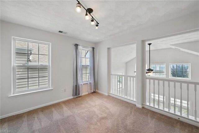 2043 Queens Point Dr, Suffolk, VA 23434 - carpeted spare room with ceiling fan, track lighting, and baseboards