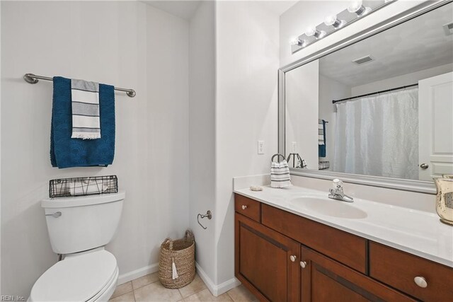 2043 Queens Point Dr, Suffolk, VA 23434 - full bath featuring toilet, vanity, tile patterned floors, and baseboards