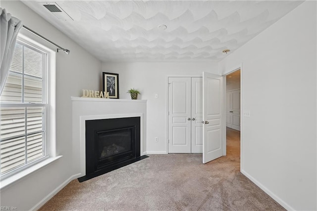 2043 Queens Point Dr, Suffolk, VA 23434 - living area with plenty of natural light, carpet, a fireplace with flush hearth, and baseboards
