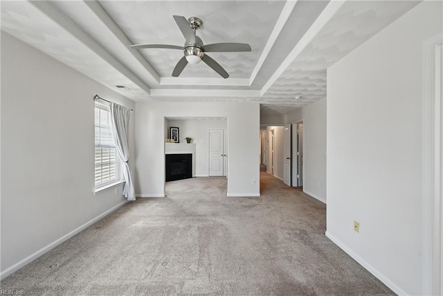 2043 Queens Point Dr, Suffolk, VA 23434 - unfurnished living room featuring a raised ceiling, a ceiling fan, a fireplace, carpet floors, and baseboards