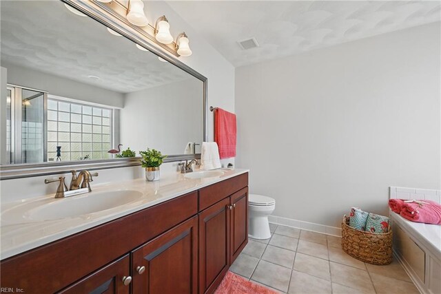 2043 Queens Point Dr, Suffolk, VA 23434 - bathroom with tile patterned floors, double vanity, a bath, toilet, and a shower with shower door