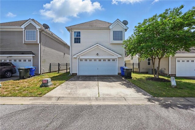 2043 Queens Point Dr, Suffolk, VA 23434 - traditional-style house featuring an attached garage, central AC unit, and concrete driveway