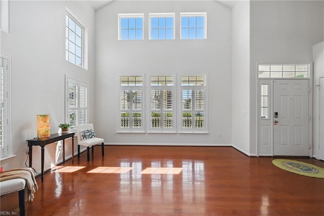 2043 Queens Point Dr, Suffolk, VA 23434 - foyer featuring a towering ceiling, wood finished floors, and baseboards