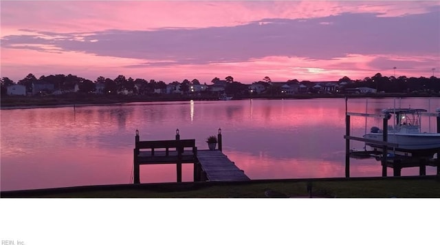 dock with a water view and boat lift