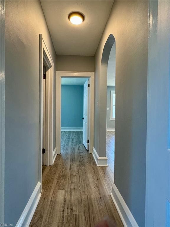 111 E Cummings Ave, Hampton, VA 23663 - hall featuring arched walkways, dark wood-type flooring, and baseboards