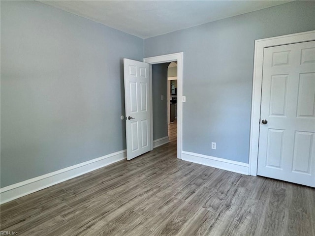 111 E Cummings Ave, Hampton, VA 23663 - unfurnished bedroom with wood finished floors and baseboards