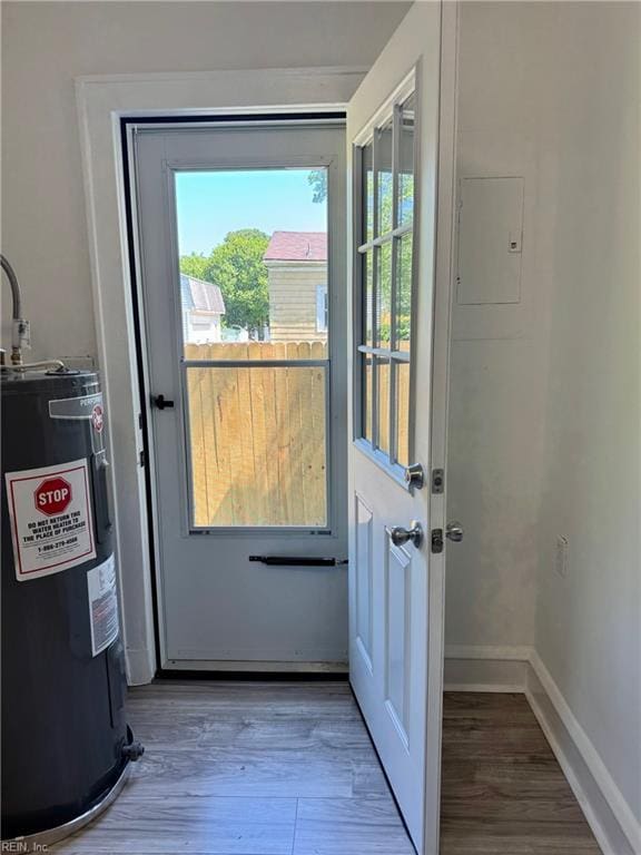 111 E Cummings Ave, Hampton, VA 23663 - doorway with electric water heater, wood finished floors, and healthy amount of natural light