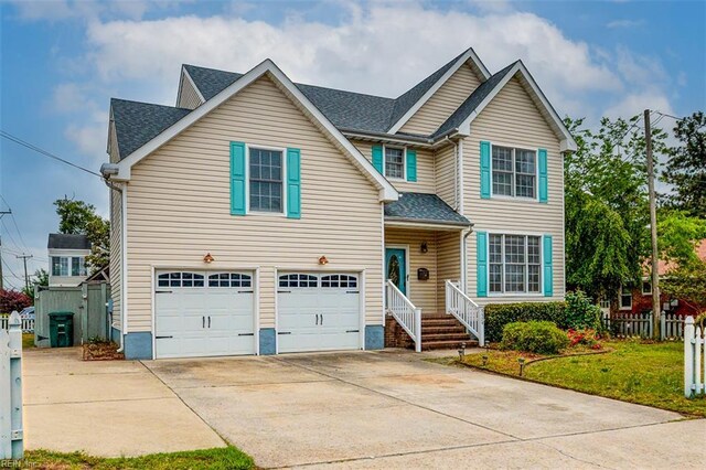9574 14th Bay St, Norfolk, VA 23518 - traditional-style house featuring an attached garage, fence, driveway, and roof with shingles