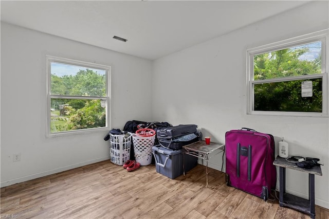 1607 Dellaire Dr, Elizabeth City, NC 27909 - empty room with healthy amount of natural light, wood finished floors, and baseboards