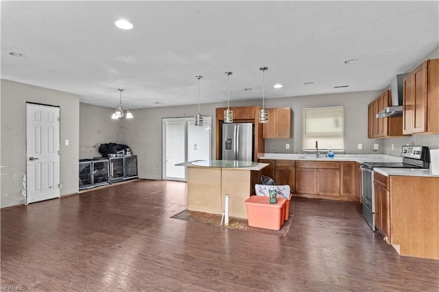 1607 Dellaire Dr, Elizabeth City, NC 27909 - kitchen featuring appliances with stainless steel finishes, a sink, dark wood finished floors, a center island, and recessed lighting