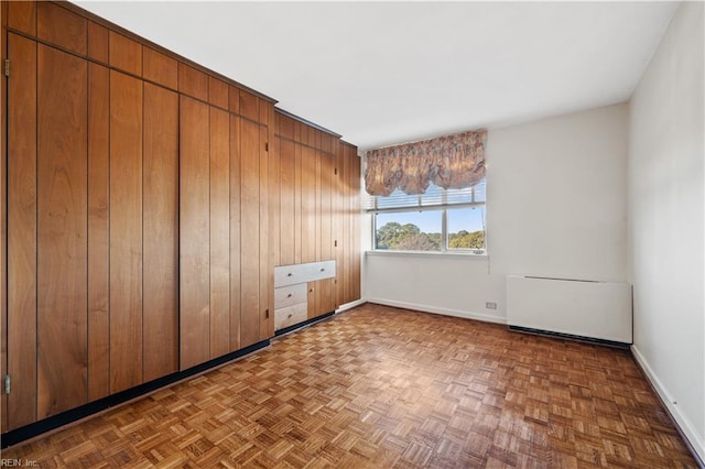 7320 Glenroie Ave Unit 8E, Norfolk, VA 23505 - spare room featuring baseboards and radiator