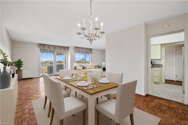 7320 Glenroie Ave Unit 8E, Norfolk, VA 23505 - dining room featuring a chandelier