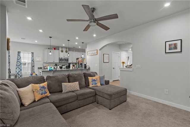 954 Olmstead St, Chesapeake, VA 23323 - living room with arched walkways, ceiling fan, recessed lighting, baseboards, and light carpet