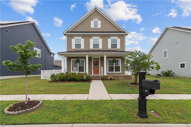 954 Olmstead St, Chesapeake, VA 23323 - traditional home featuring a standing seam roof, covered porch, a front yard, and metal roof