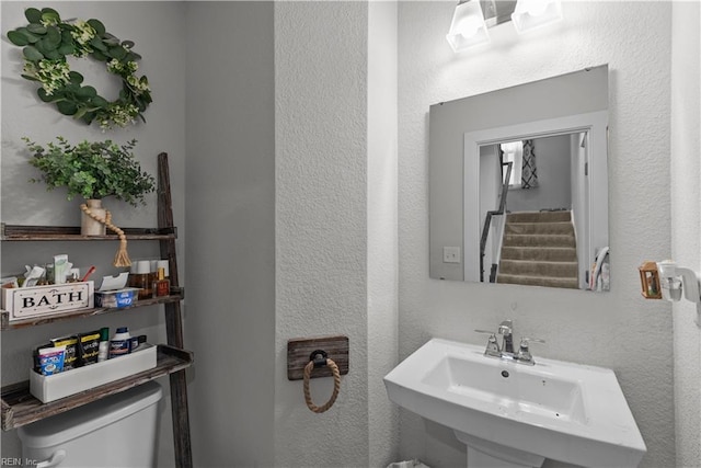 954 Olmstead St, Chesapeake, VA 23323 - bathroom featuring a sink, toilet, and a textured wall