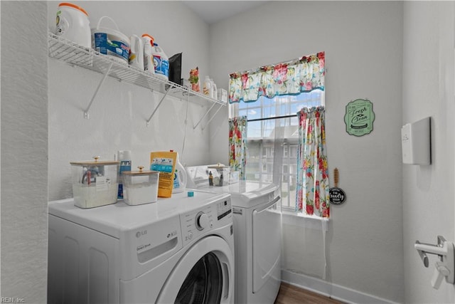 954 Olmstead St, Chesapeake, VA 23323 - clothes washing area featuring washing machine and dryer, baseboards, and wood finished floors