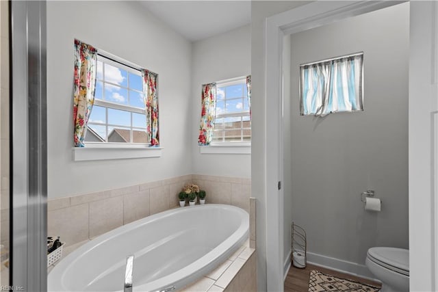 954 Olmstead St, Chesapeake, VA 23323 - bathroom featuring toilet, a bath, and baseboards