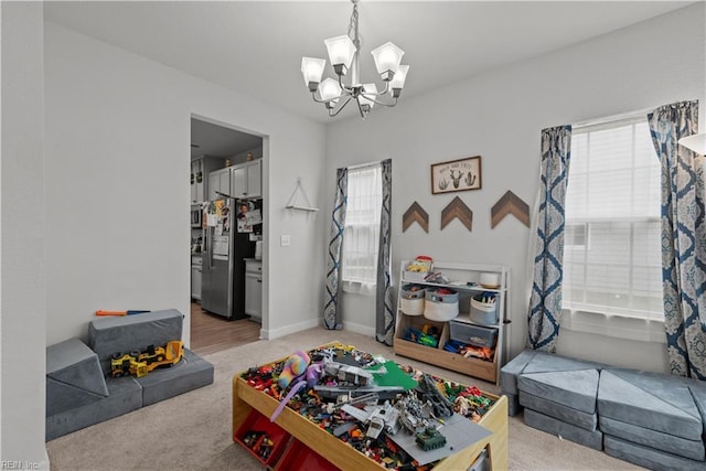 954 Olmstead St, Chesapeake, VA 23323 - recreation room featuring a chandelier, carpet, and baseboards
