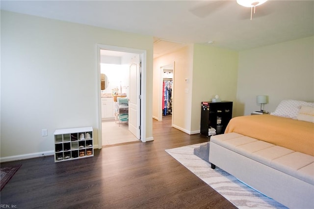 2933 Crossings Dr, Chesapeake, VA 23321 - bedroom with dark wood finished floors, baseboards, ceiling fan, and ensuite bathroom