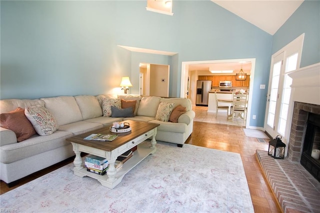 2933 Crossings Dr, Chesapeake, VA 23321 - living room with high vaulted ceiling, a brick fireplace, and baseboards