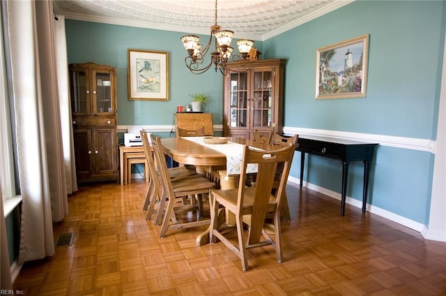 2933 Crossings Dr, Chesapeake, VA 23321 - dining room with a chandelier, ornamental molding, and baseboards