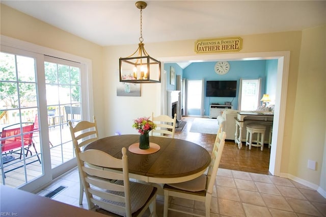 2933 Crossings Dr, Chesapeake, VA 23321 - dining room with plenty of natural light, baseboards, and a fireplace