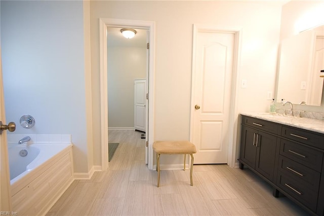2933 Crossings Dr, Chesapeake, VA 23321 - bathroom featuring vanity, a bath, and baseboards
