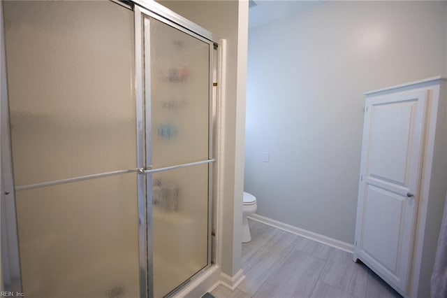 2933 Crossings Dr, Chesapeake, VA 23321 - bathroom with a stall shower, baseboards, and toilet