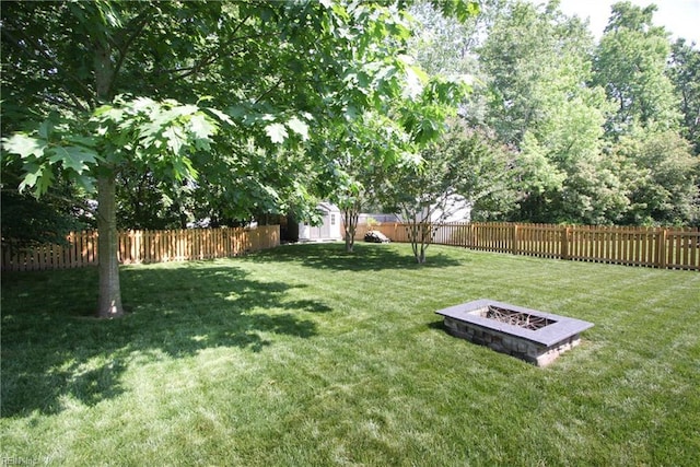 2933 Crossings Dr, Chesapeake, VA 23321 - view of yard with a shed, an outbuilding, and an outdoor fire pit