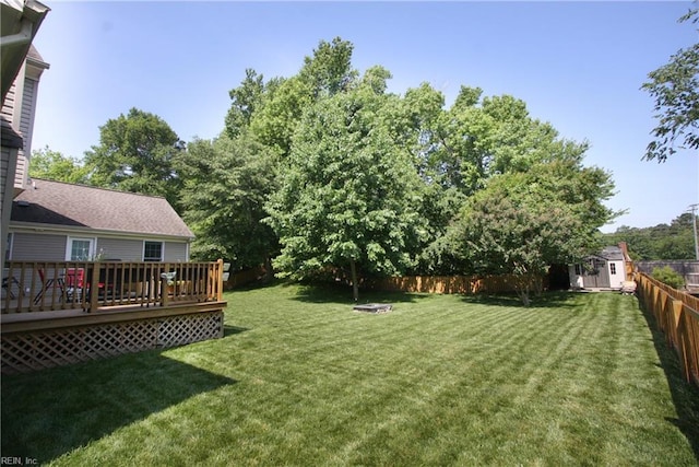 2933 Crossings Dr, Chesapeake, VA 23321 - view of yard with a storage unit, an outbuilding, and a deck