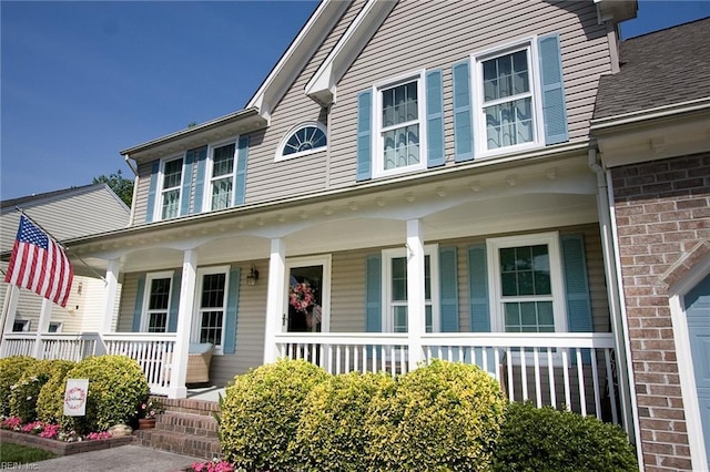 2933 Crossings Dr, Chesapeake, VA 23321 - view of front of property featuring a porch, brick siding, and a shingled roof