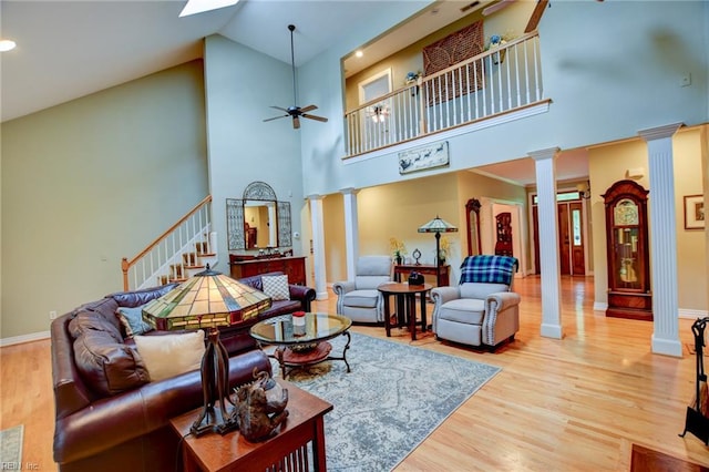 1813 Taft Rd, Chesapeake, VA 23322 - living room with ornate columns, a ceiling fan, high vaulted ceiling, wood finished floors, and stairway