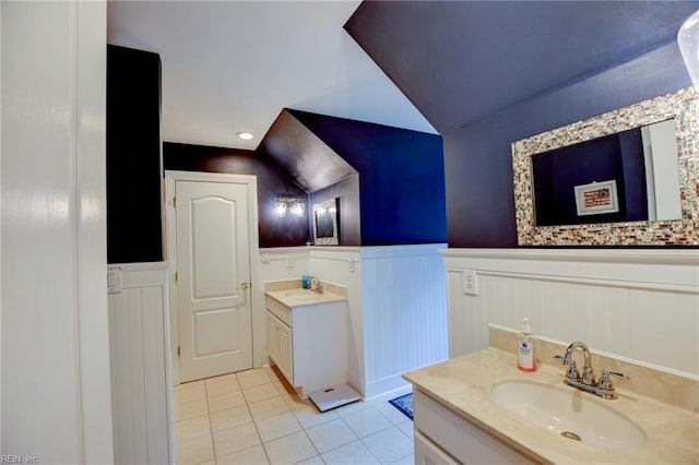 1813 Taft Rd, Chesapeake, VA 23322 - bathroom featuring lofted ceiling, a wainscoted wall, tile patterned flooring, vanity, and a decorative wall