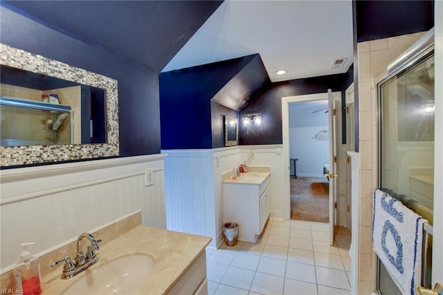 1813 Taft Rd, Chesapeake, VA 23322 - full bath with tile patterned flooring, a stall shower, a wainscoted wall, two vanities, and a decorative wall
