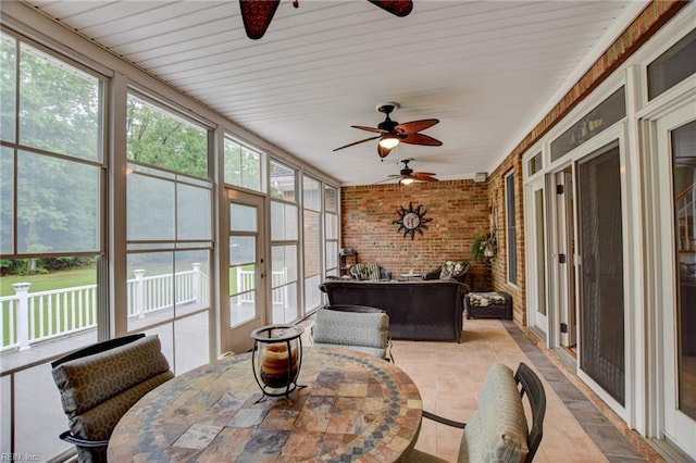 1813 Taft Rd, Chesapeake, VA 23322 - sunroom / solarium featuring a ceiling fan, brick wall, outdoor dining space, and tile patterned floors