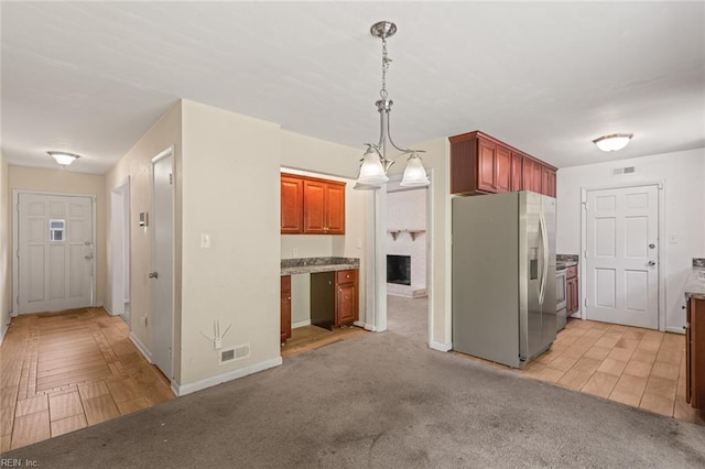 102 Basswood Dr, Newport News, VA 23601 - kitchen featuring stainless steel refrigerator with ice dispenser, baseboards, decorative light fixtures, light carpet, and light countertops
